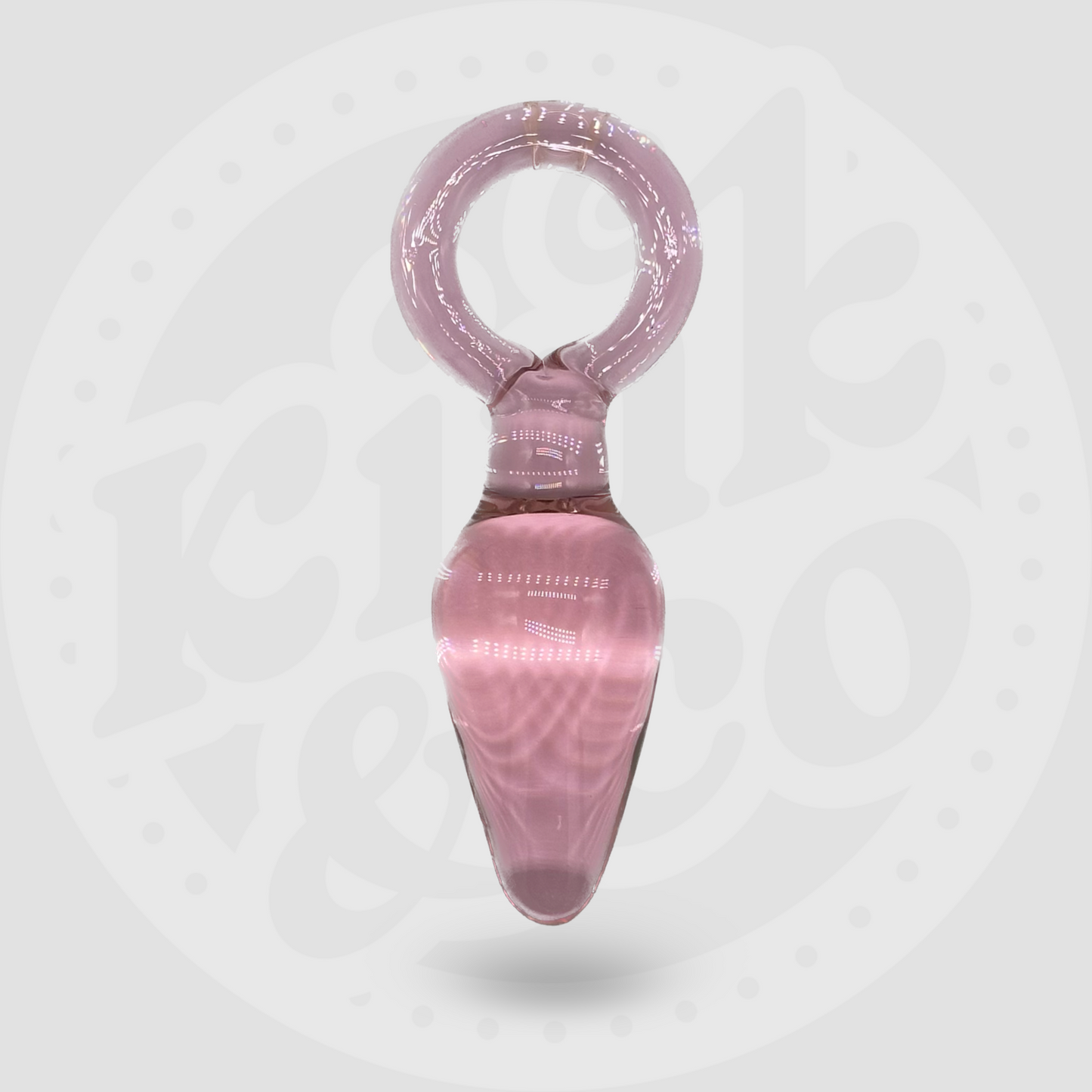 Tapón anal de cristal rosa con forma de lágrima y mango de aro