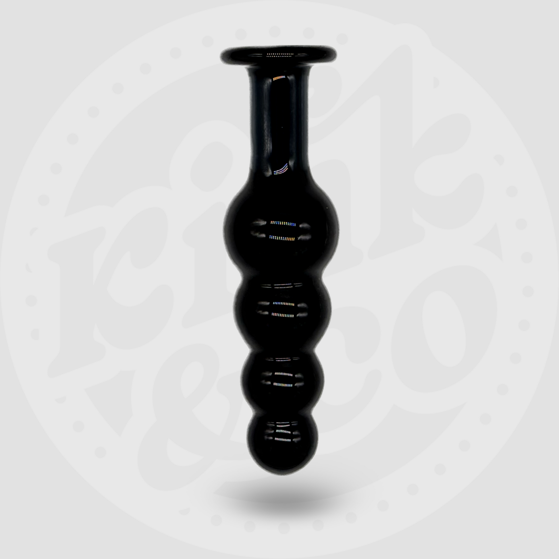 Large black glass beaded sex toy with flat handle stood upright with a white and grey background showing the logo for Kink&Co