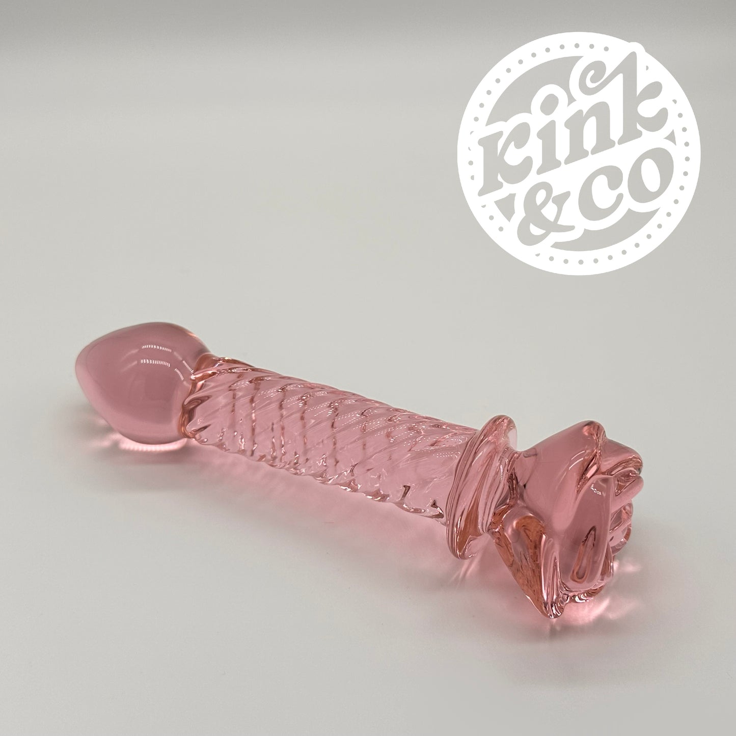 Side of Glass Dildo Pink Rose With Spiral Ridged Body - By Kink&Co